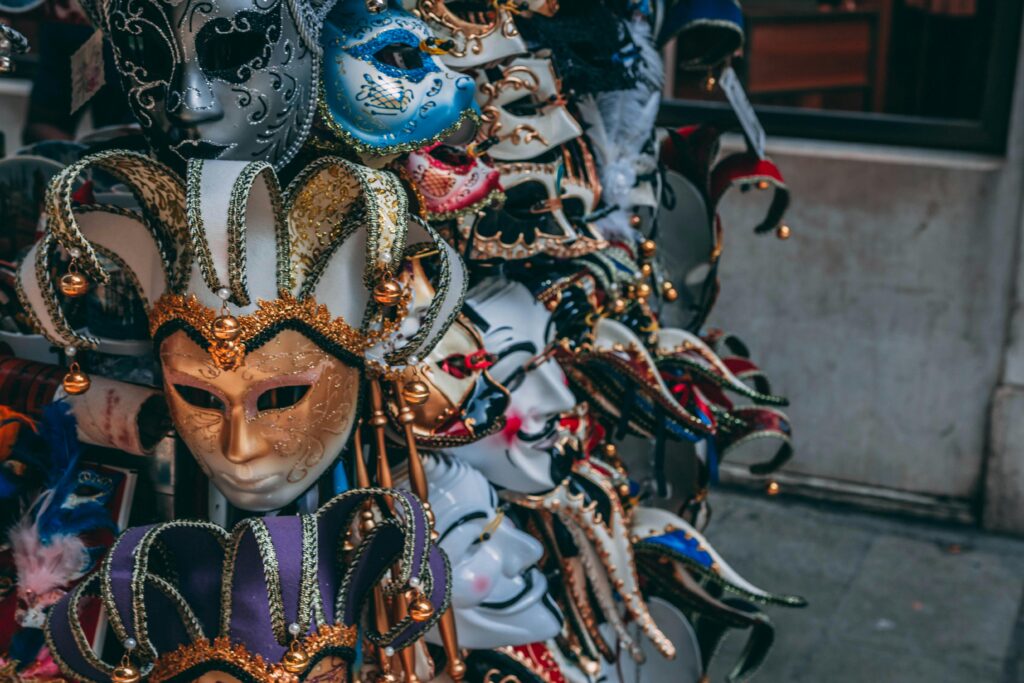 A vibrant display of traditional Venetian masquerade masks showcasing intricate designs.