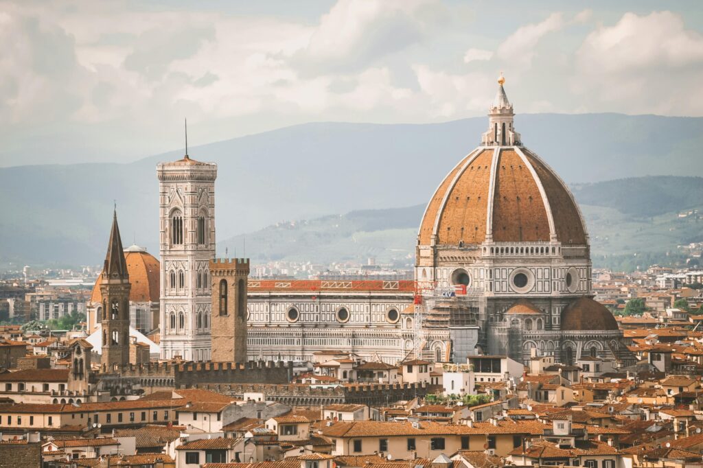 A breathtaking view of Florence Cathedral, also known as Il Duomo, with the cityscape at dawn.