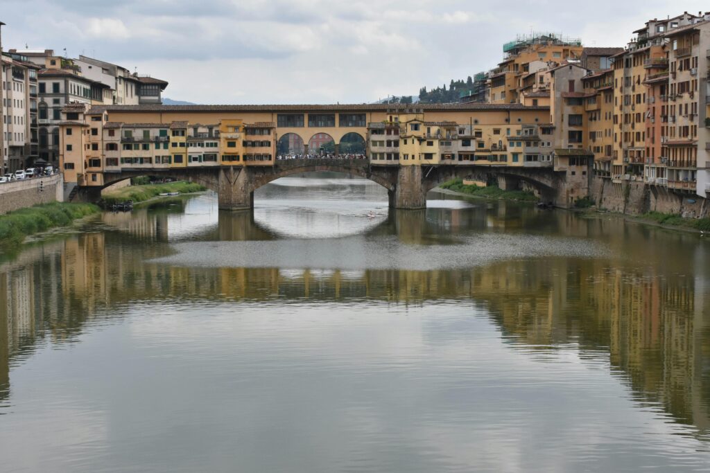 Discover the timeless beauty of Ponte Vecchio spanning the Arno River in Florence.
