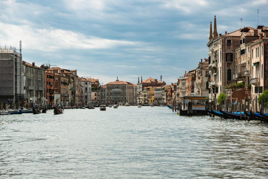 Scenic view of Venice's Grand Canal showcasing historic buildings and gondolas.