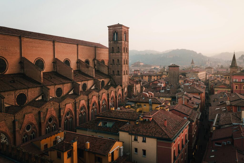 A breathtaking aerial view of Bologna's historic architecture at dusk, highlighting its rustic charm.