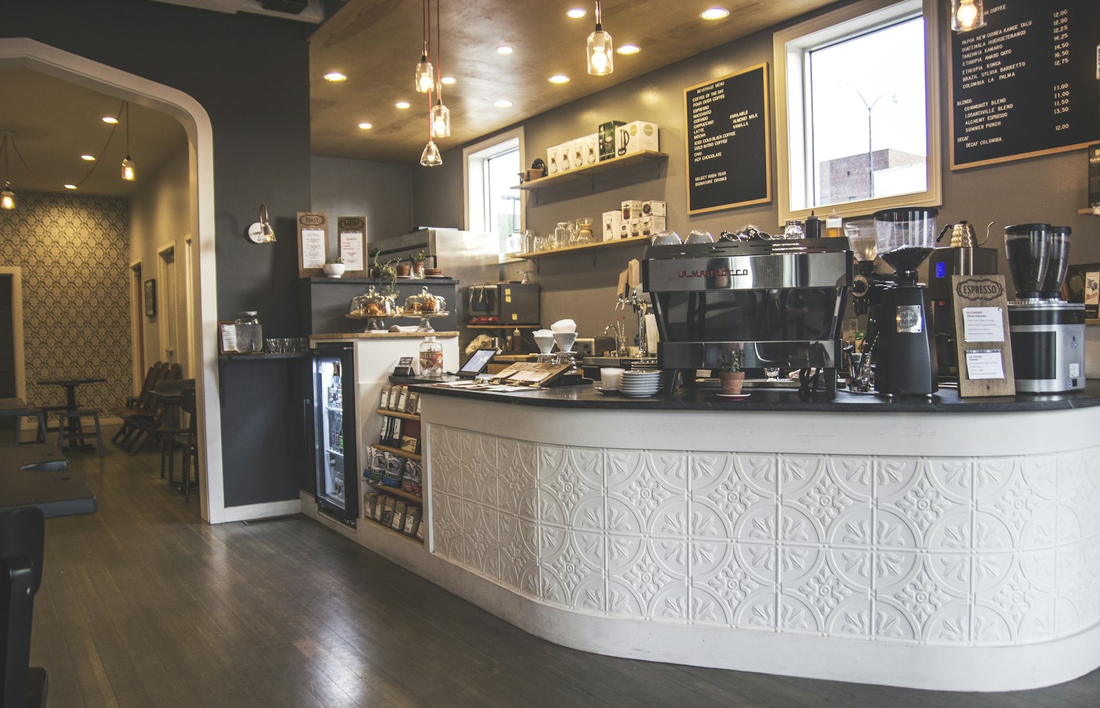 Bar counter with espresso machines where drinks are collected after paying