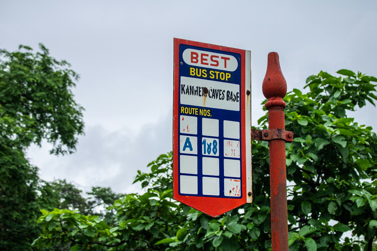 Bus stop sign at the roadside where a temporary notice would be posted