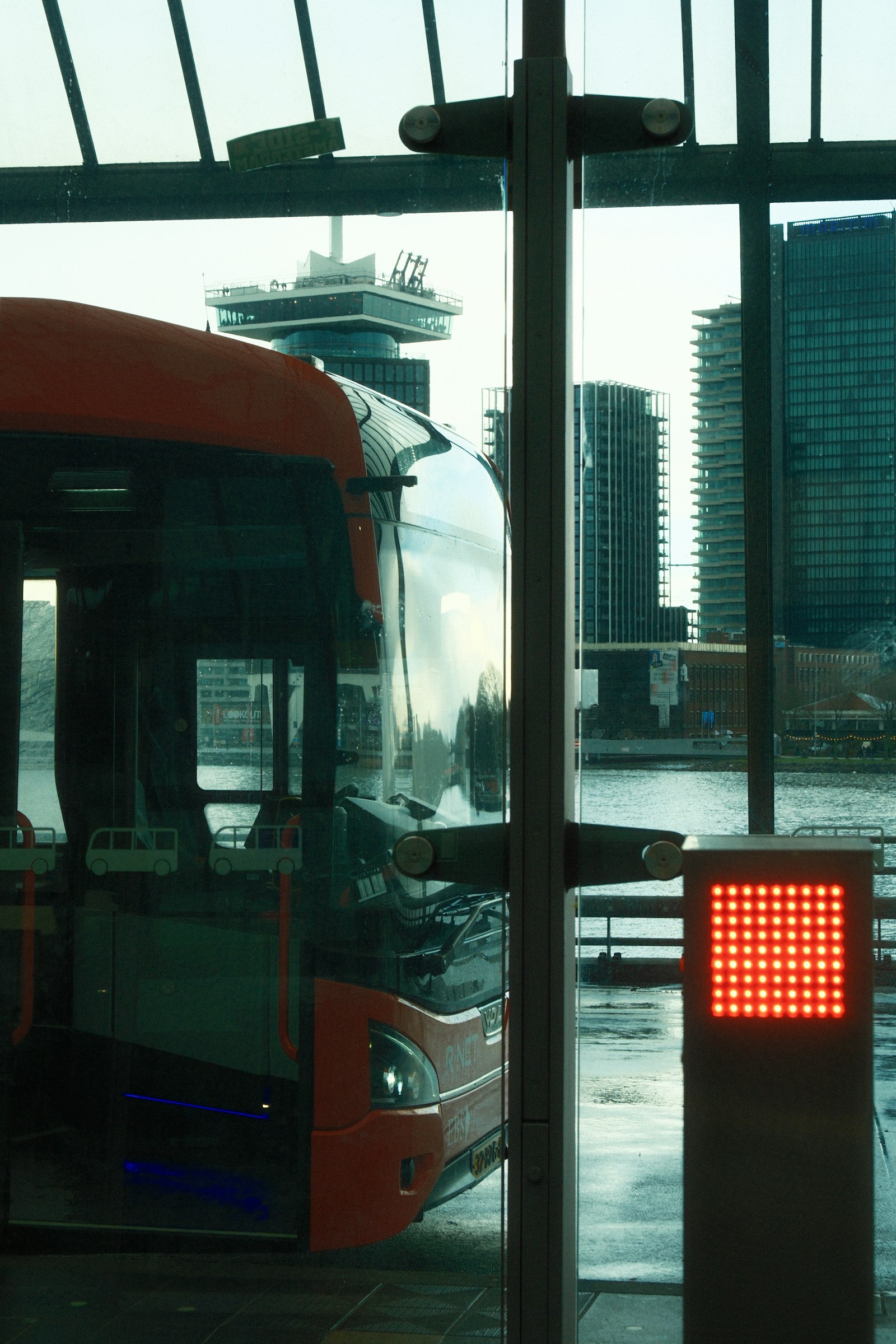 City bus waiting at a stop in Rome with its destination display lit