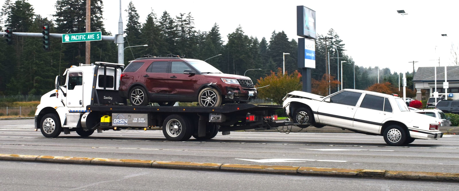 Car loaded onto a flatbed tow truck for recovery