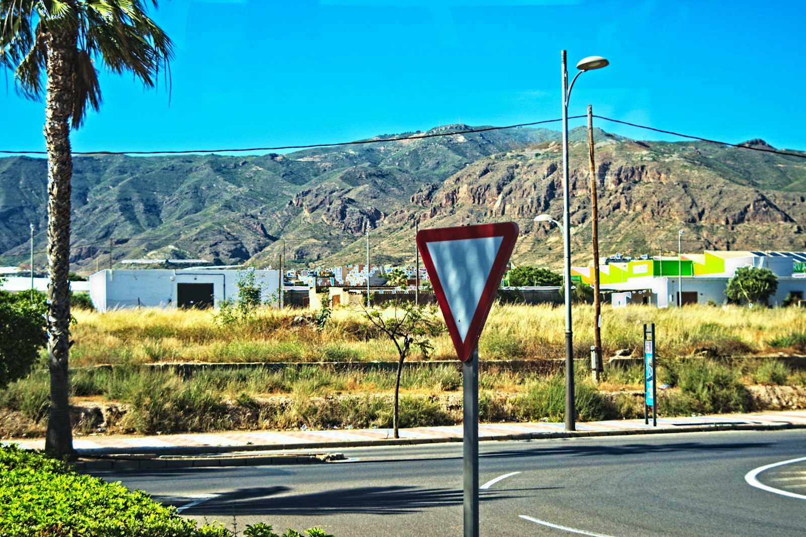 Triangular give way sign at the entrance to a road junction