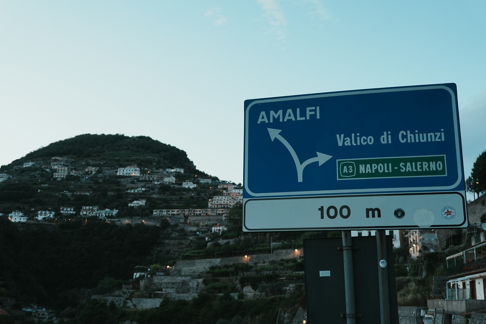 Road sign on an Italian coastal road served by seasonal summer buses