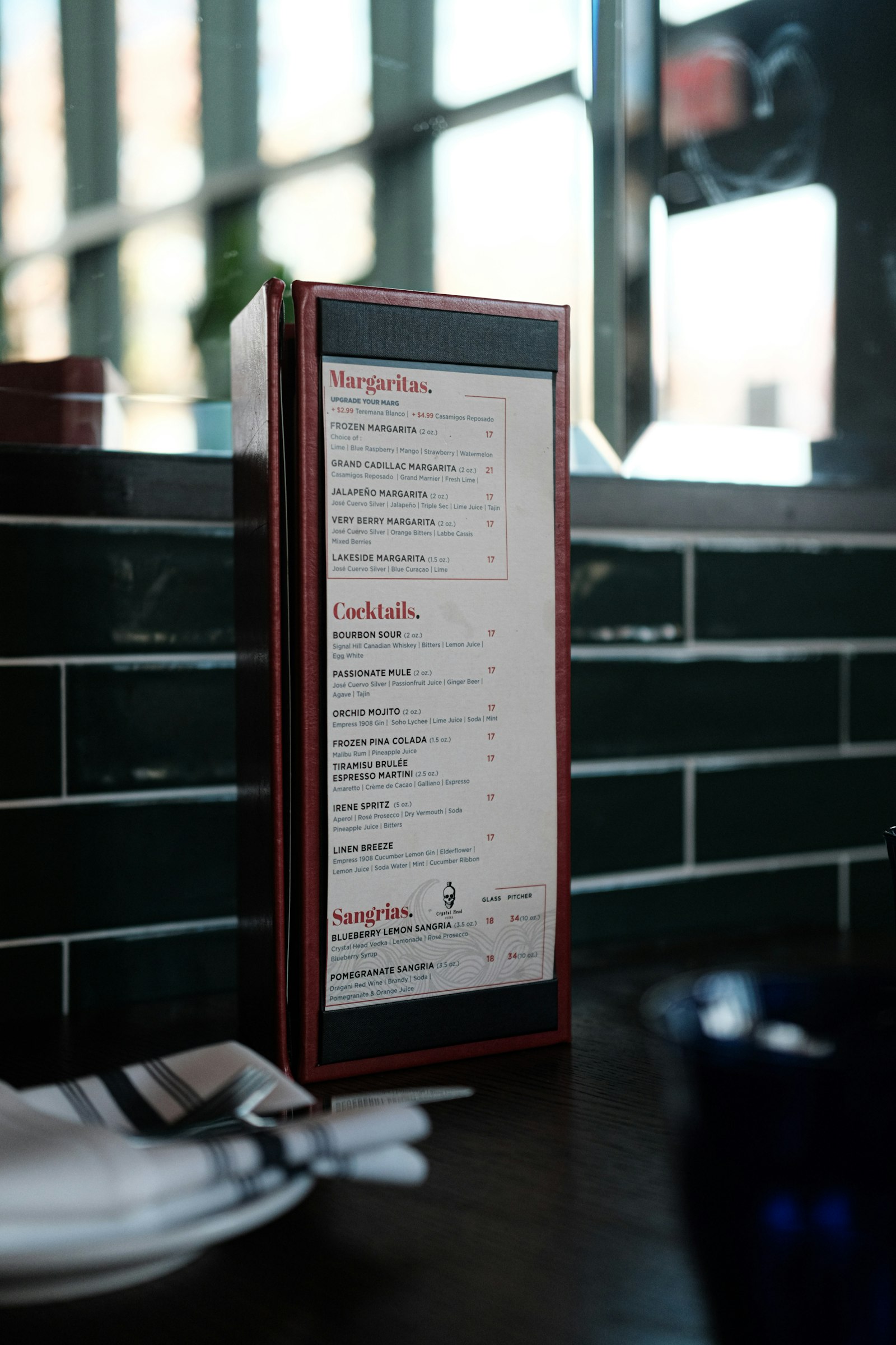 Printed restaurant menu lying open on a table