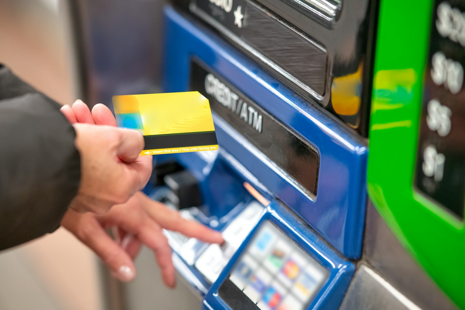 Person paying with a bank card at a self-service machine