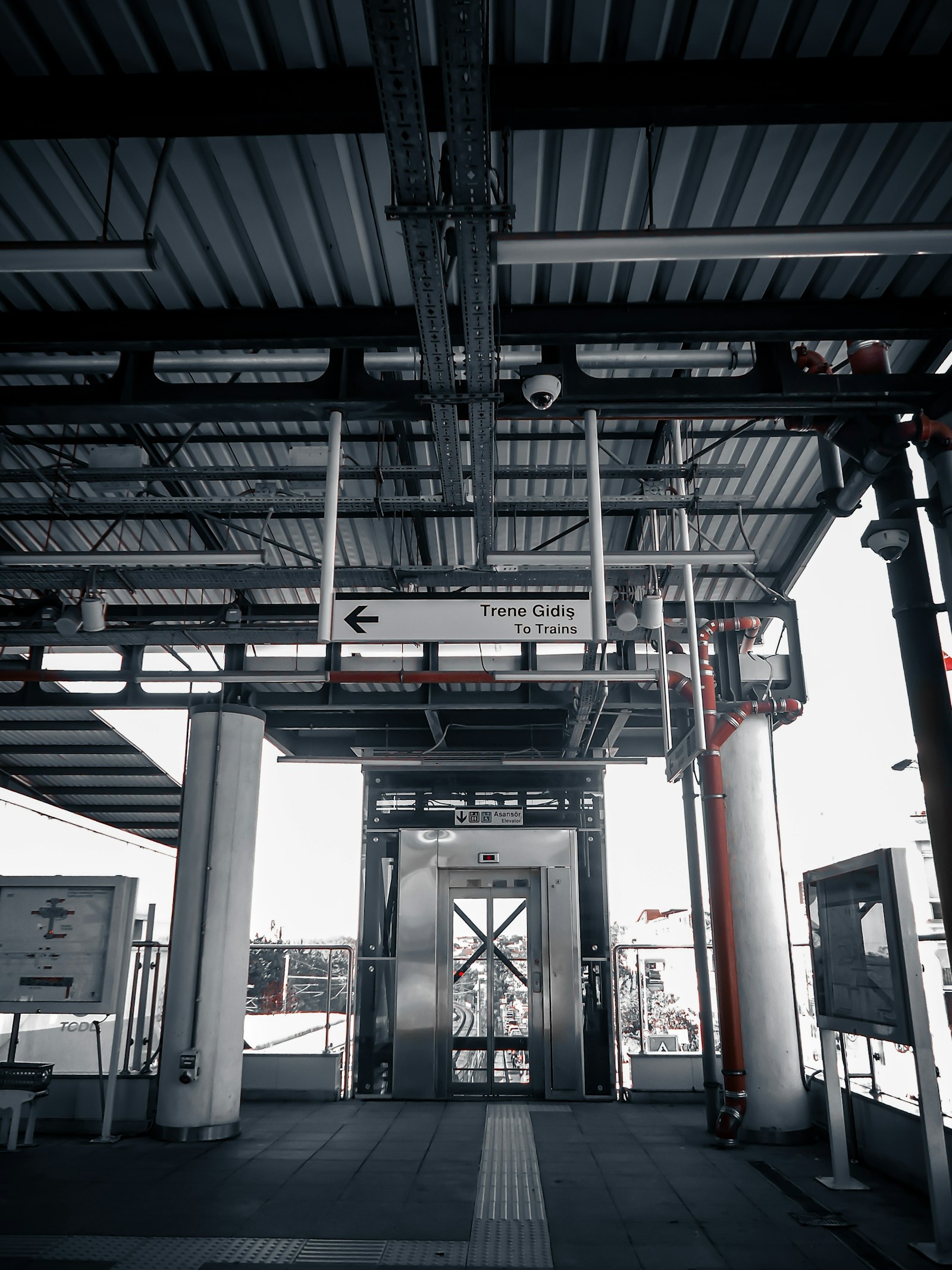 Lift entrance beside a railway station platform