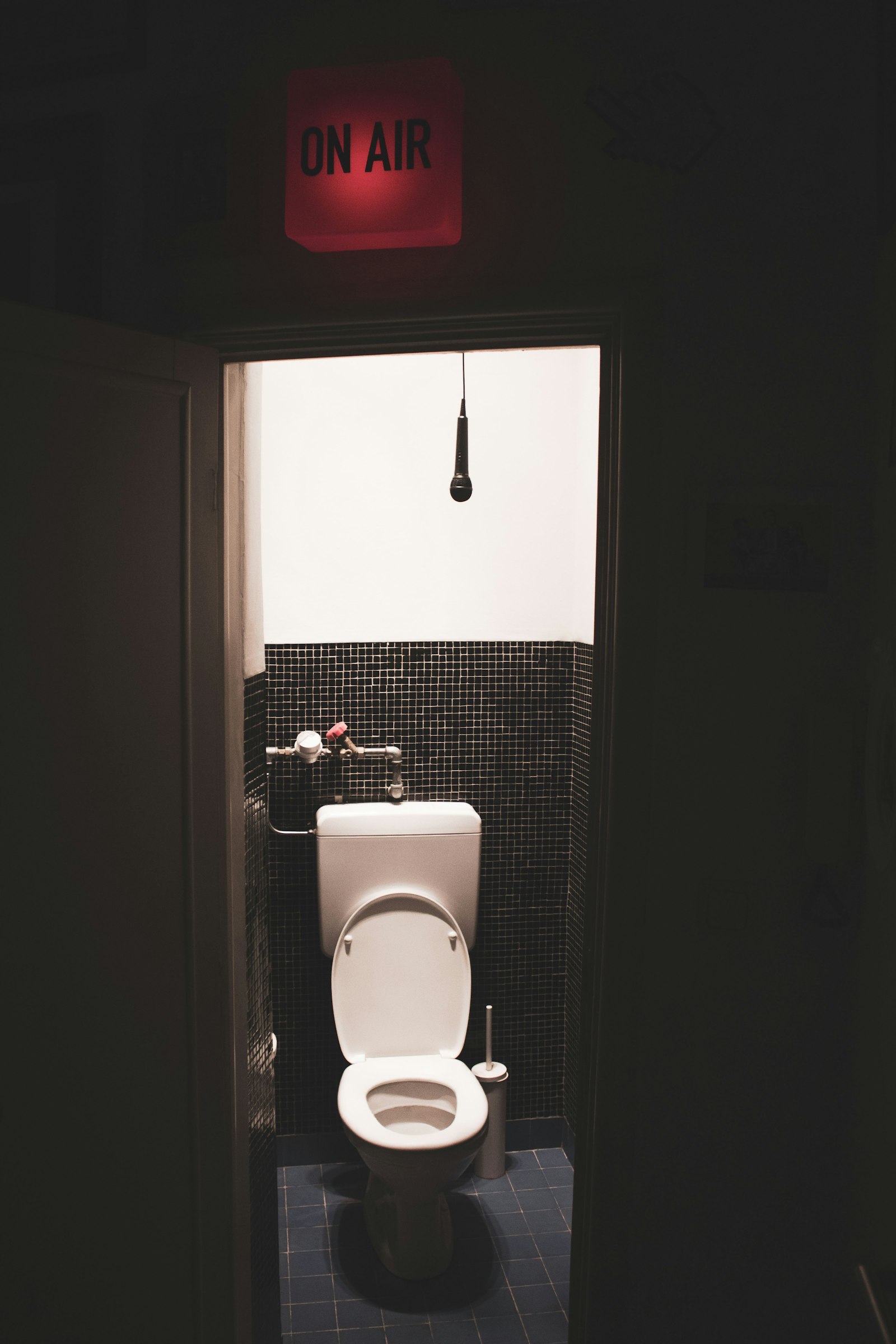Compact white toilet cubicle of the kind found on trains