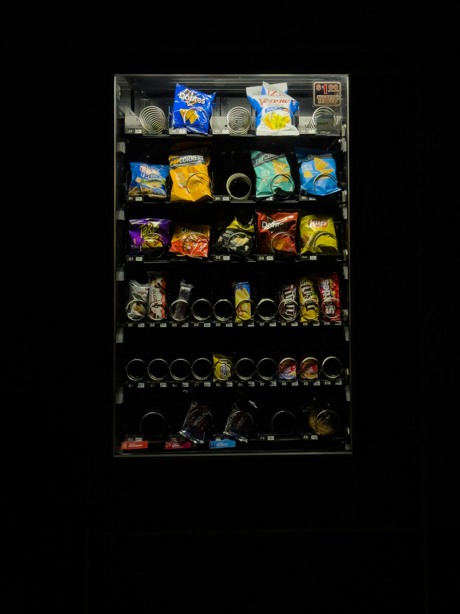 Vending machine stocked with snacks and drinks