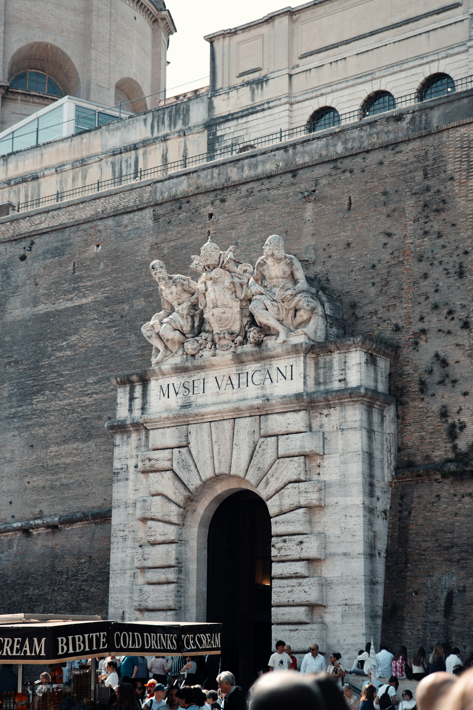Visitors waiting outside a museum entrance before a timed entry slot