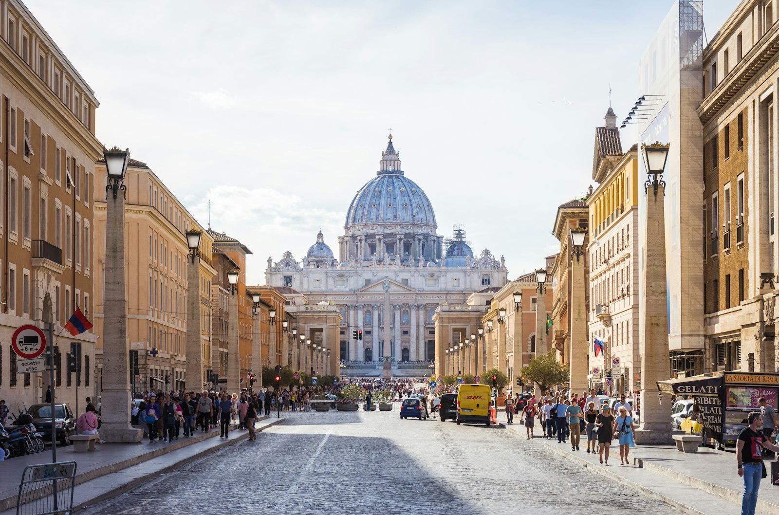 People walking along the street towards St Peter’s Basilica in Rome