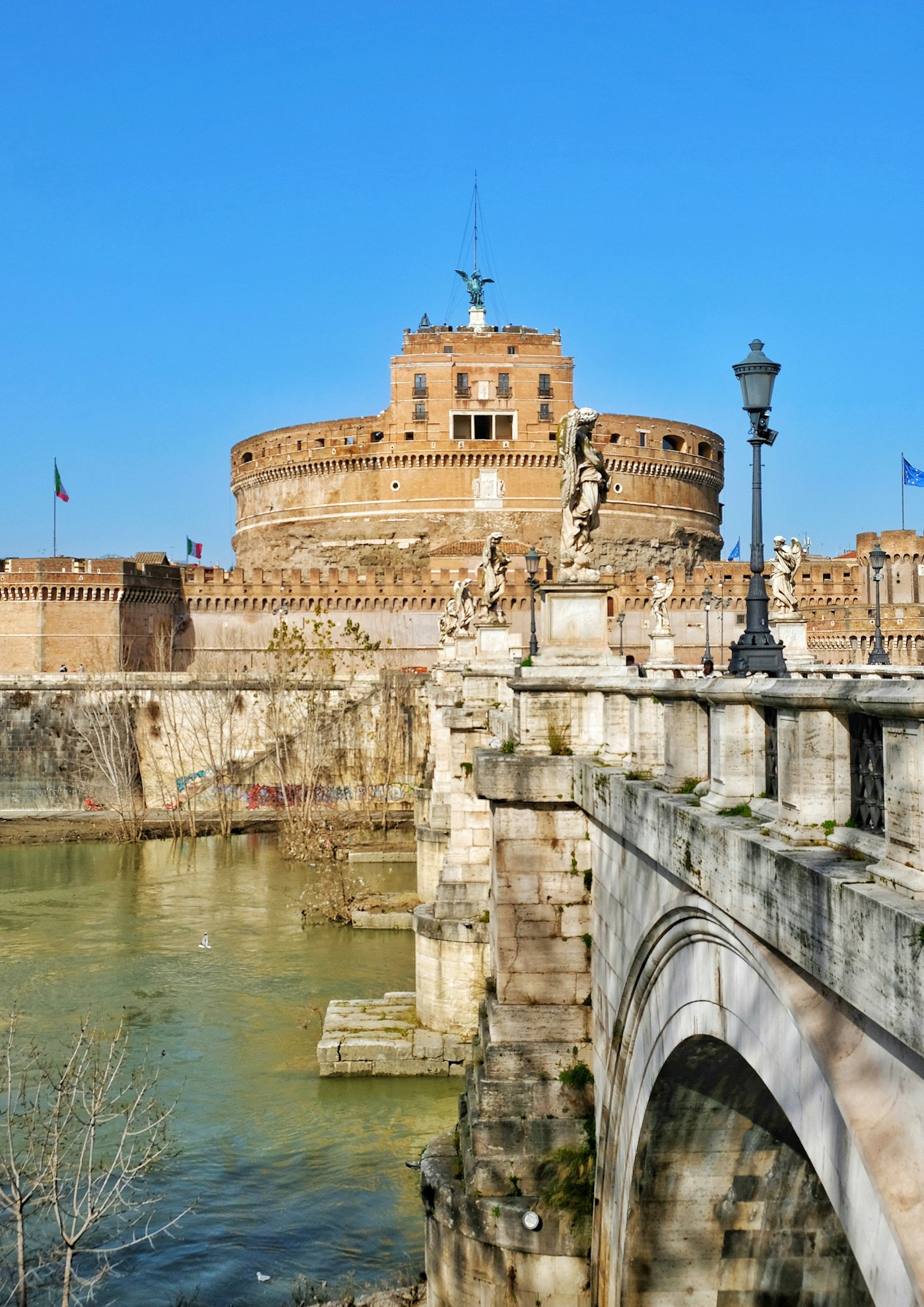 Castel Sant’Angelo in Rome seen from across the Tiber with Ponte Sant’Angelo in the foreground