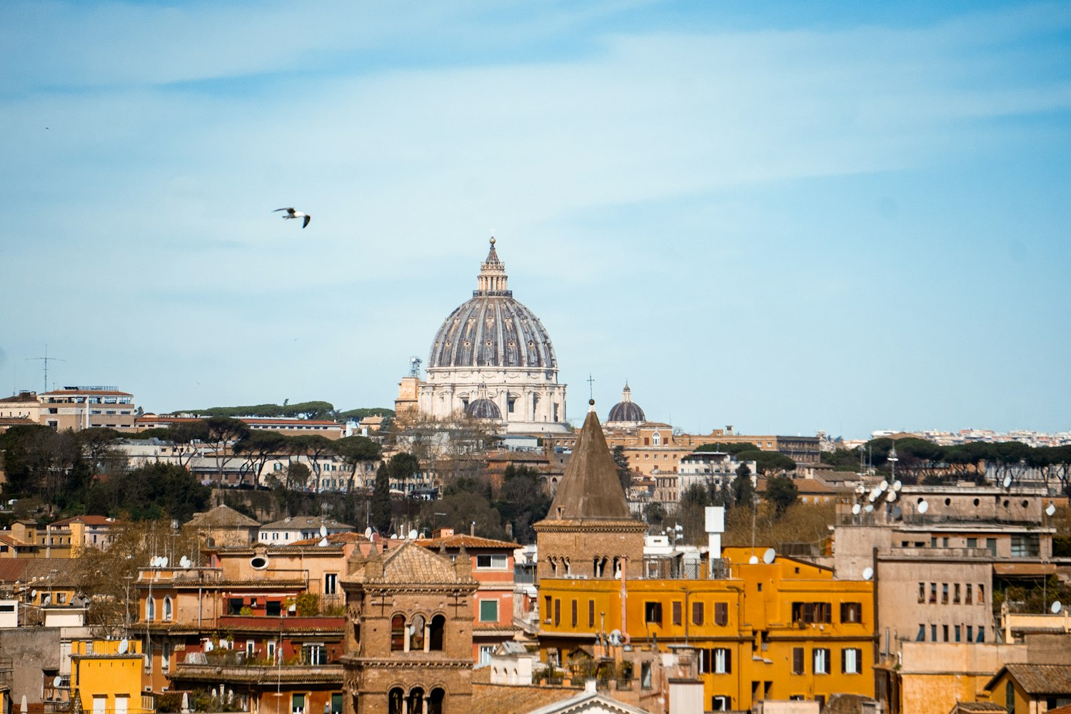 Rooftops of Rome with the dome of St Peter’s Basilica rising in the distance