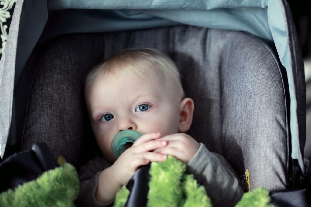 Baby sitting in a padded child seat