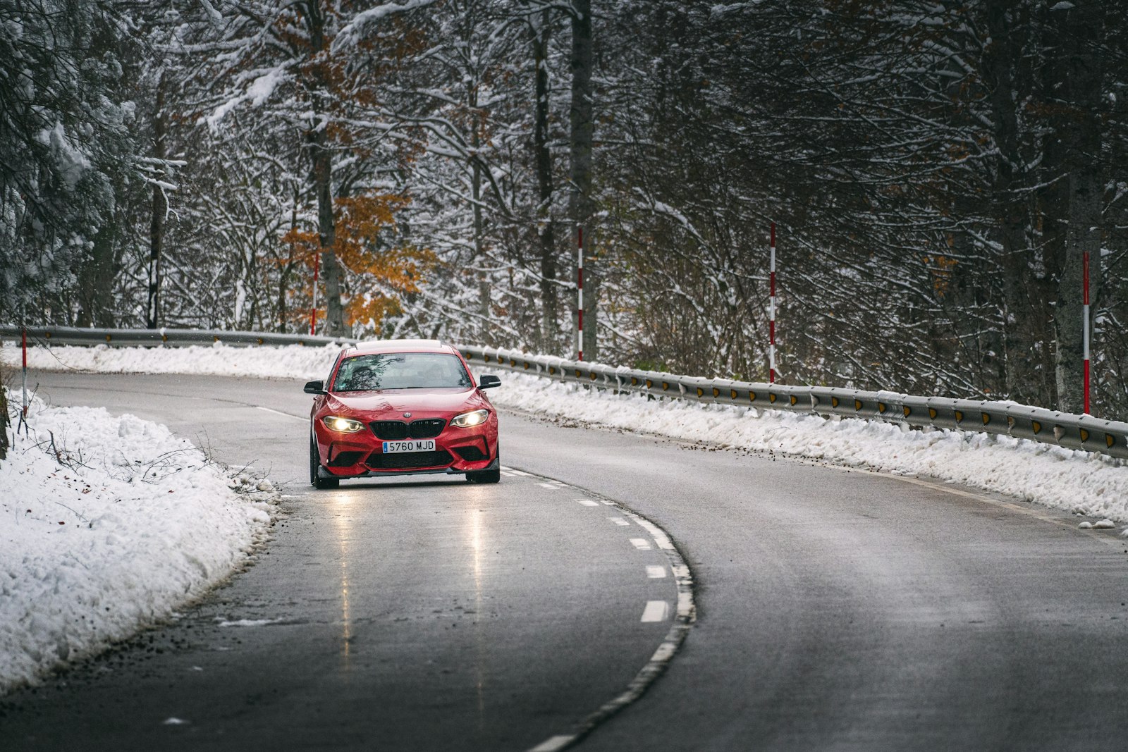Car driving along a winding mountain road in Italy