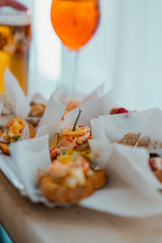 Small appetisers served with an orange spritz