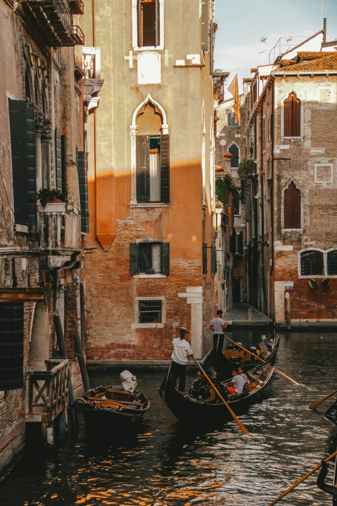 Small boats moored along a quiet Venice canal