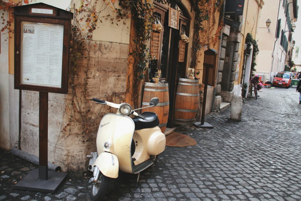 Vintage scooter parked on a cobbled street